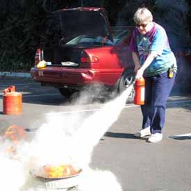 Mary Lou extinguishing a fire