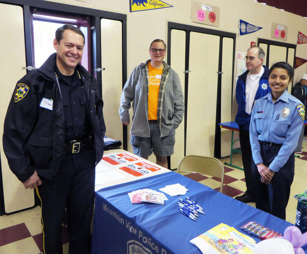 MVPD Chief Max Bosel, Neighborhood Watch Chair Tom Purcell, and two MVPD volunteers are ready for Spring Fling to begin.